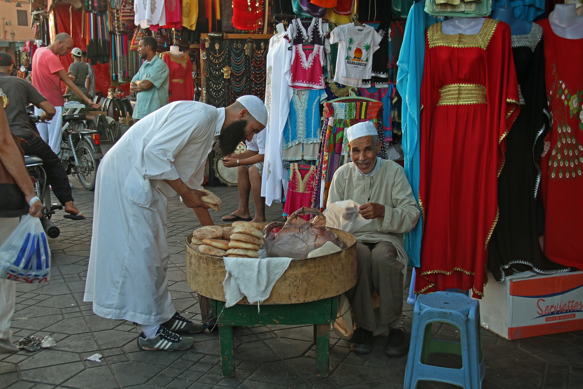 Arab men speaking to each other in market in Morocco