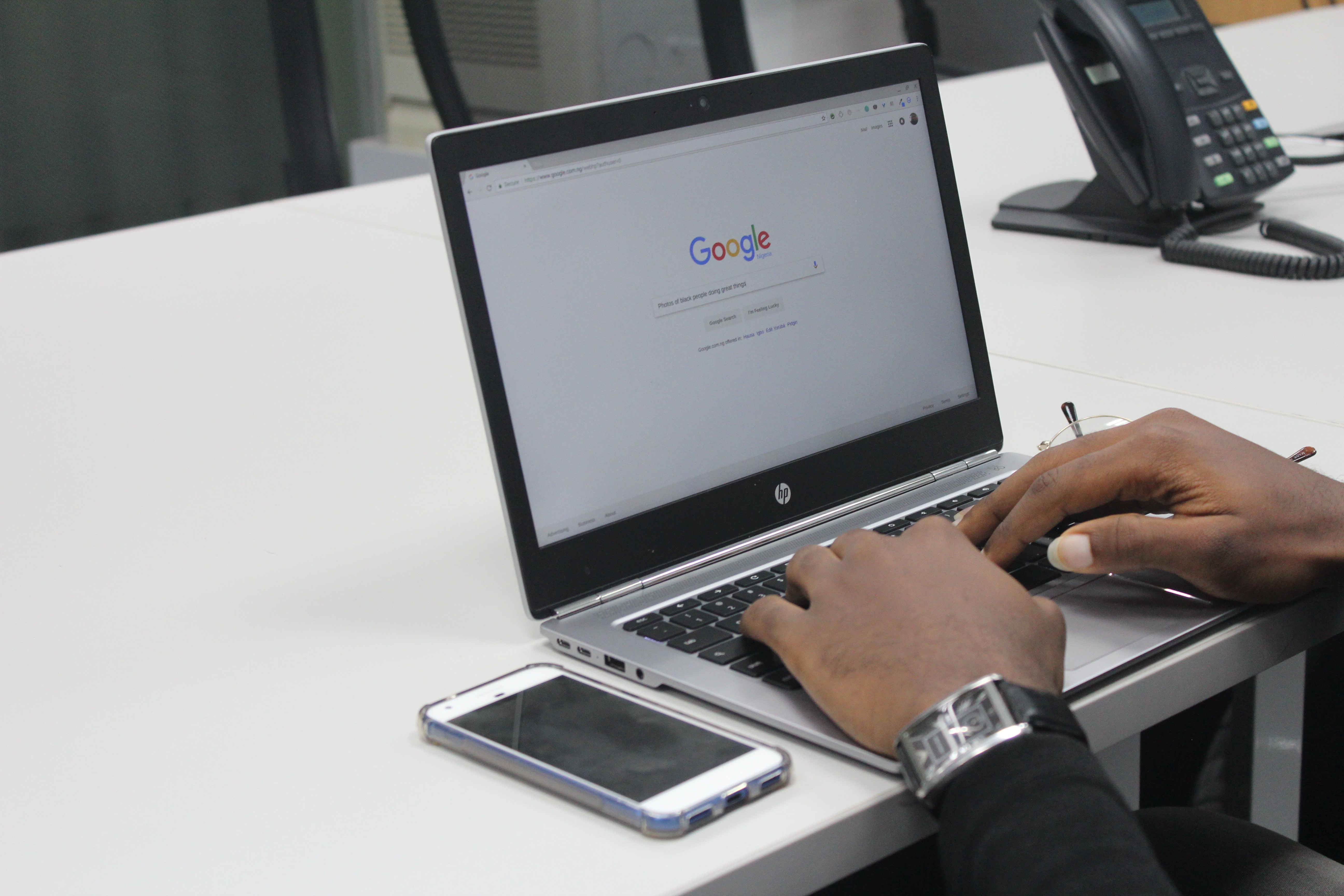 Person typing on Google.