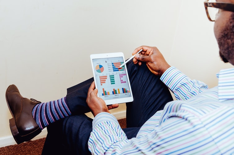 Man looking at spreadsheets