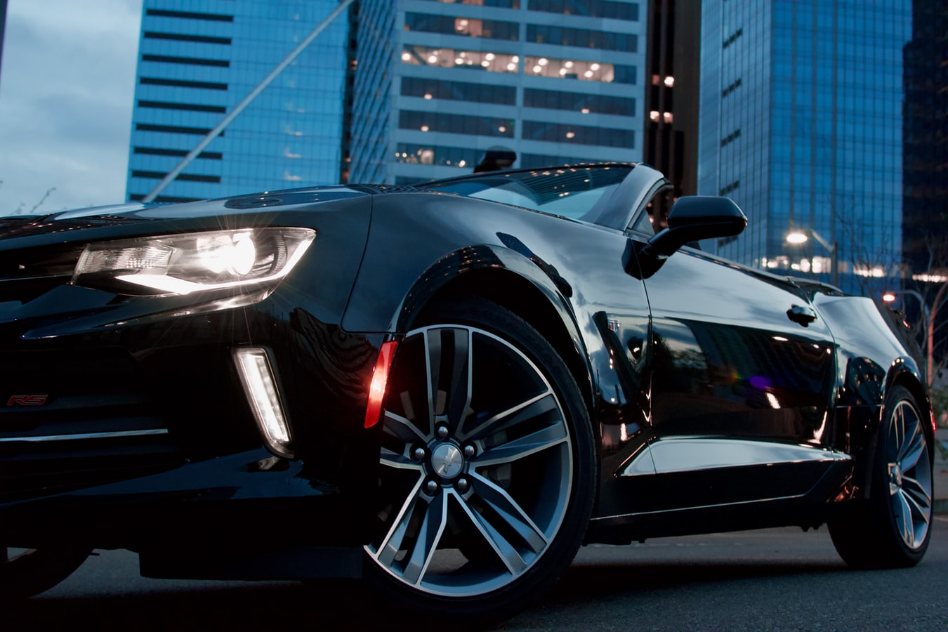 Car in front of high rise building
