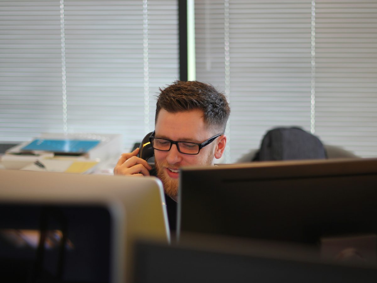Person in an office taking a phone call