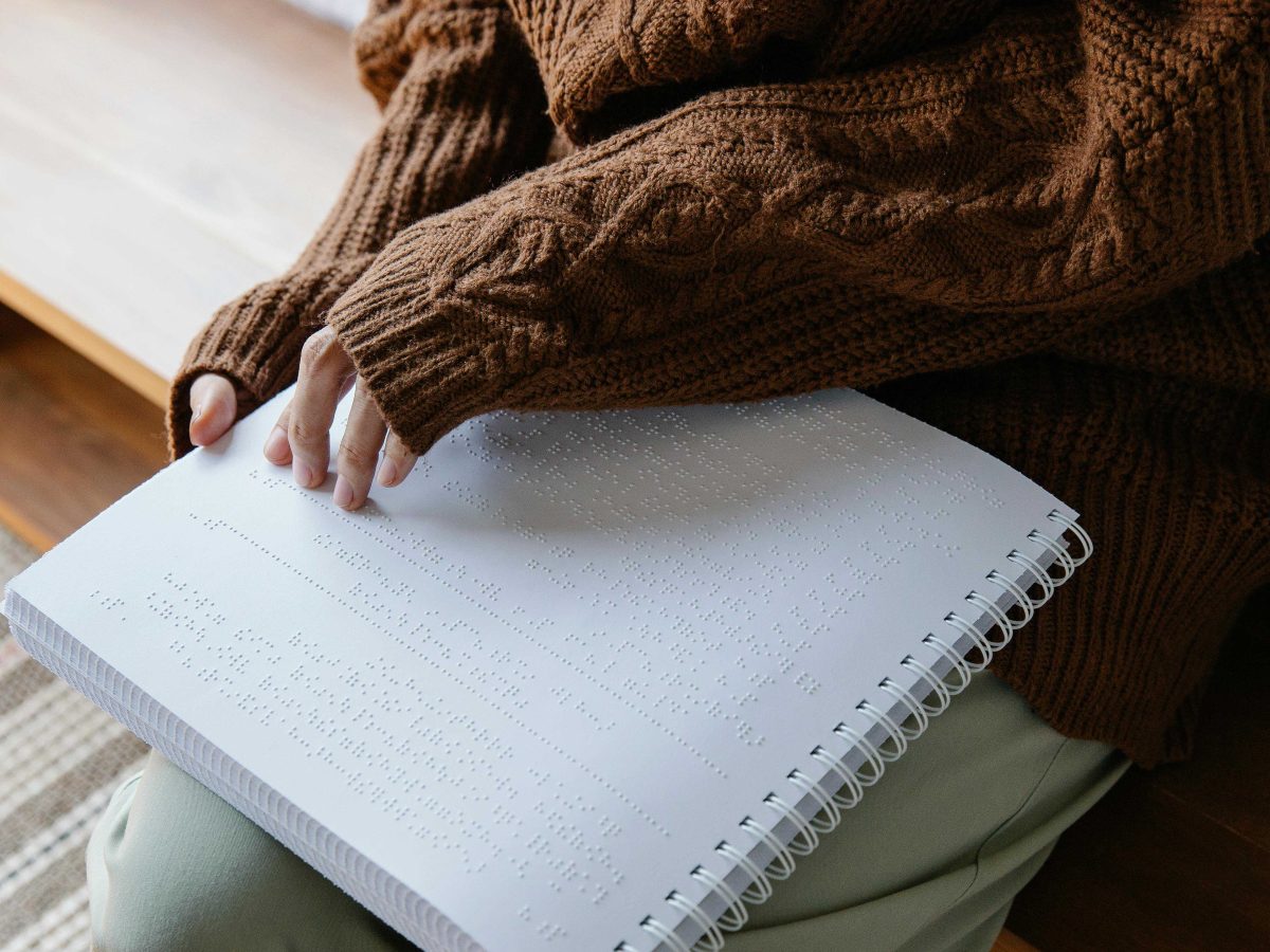 Person reading braille