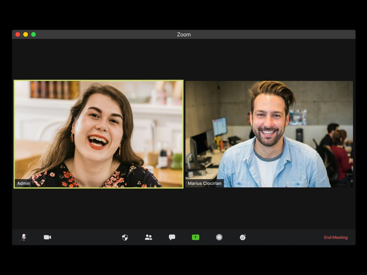 Interface of a video call, showing a man and woman talking.